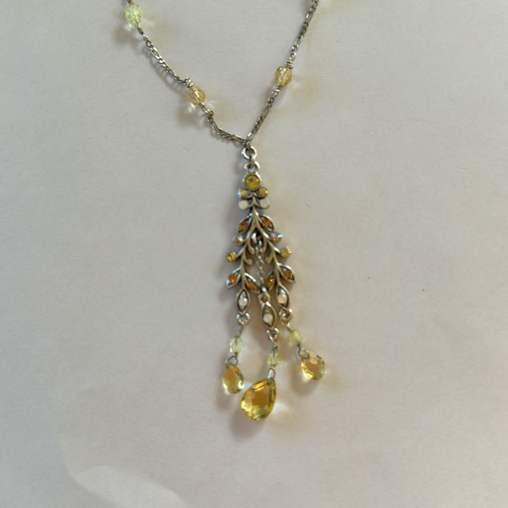 bohm necklace with pale yellow and green stones.
